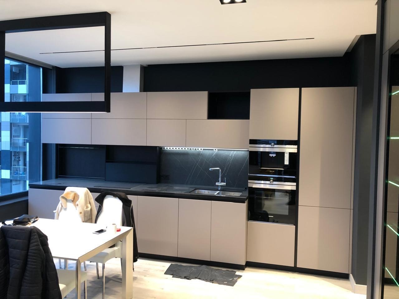 Modern kitchen with black accent in Newport Beach, CA